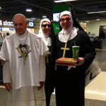 penguins fans with pope cutout